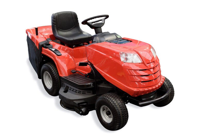 rotary red tractor mower isolated on a white background. 