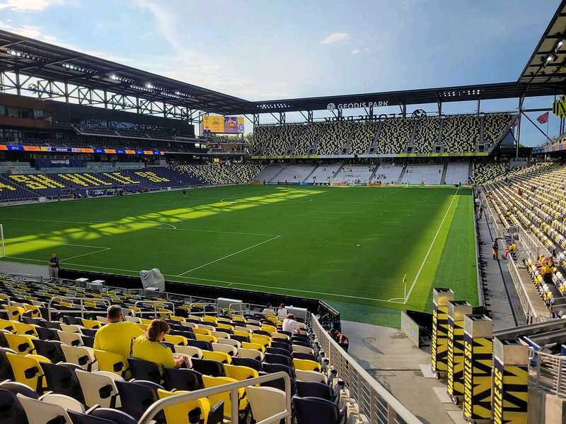 GEODIS Park hosting a soccer game, black and yellow seats spell “NASHVILLE.”