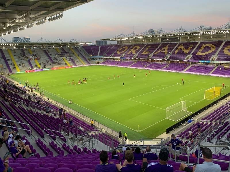 Evening soccer warmups in purple-themed Inter&Co Stadium, home of Orlando City SC.