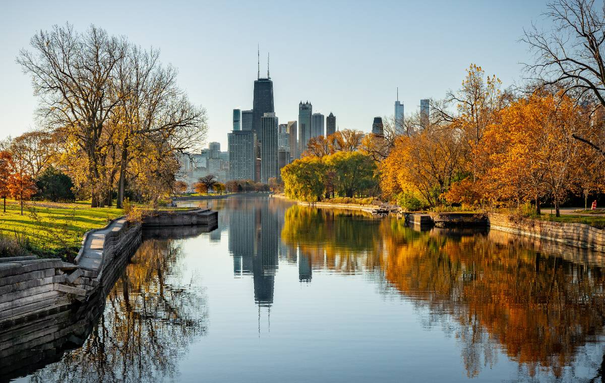 Chicago skyline seen from the north at dawn in Autumn with canal.