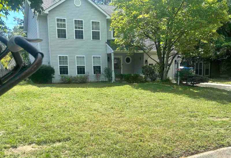 Well-maintained front lawn with neatly mowed grass in front of a house in Washington, D.C.
