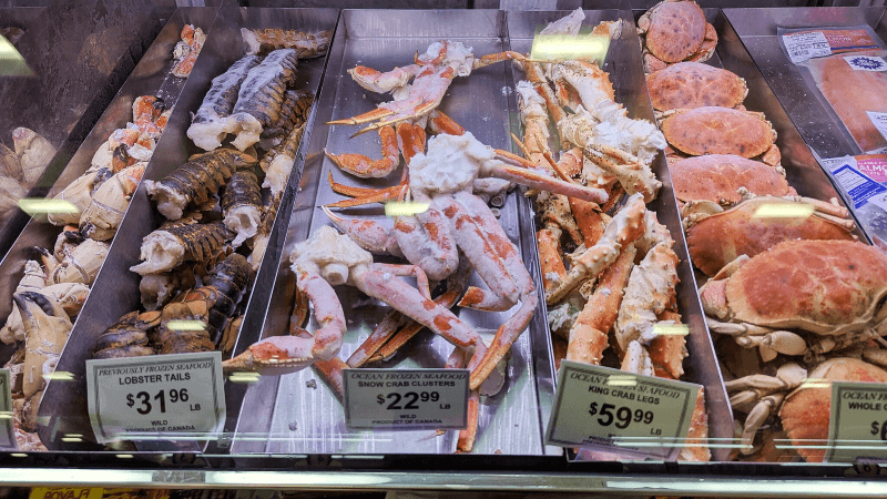 Lobster tails, crab legs, and other shellfish in a Massachusetts grocery store