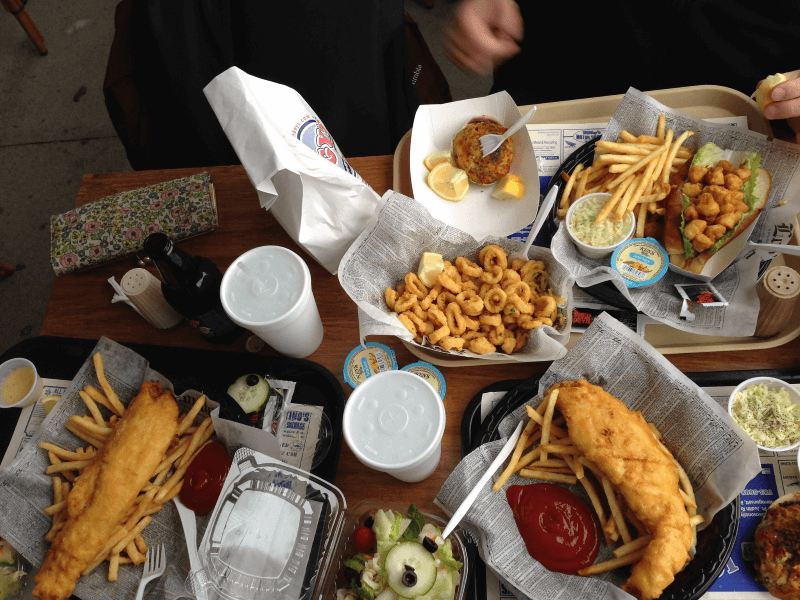 A table full of seafood platters at a restaurant in Rhode Island