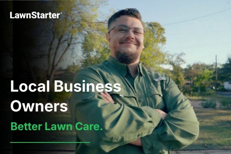 LawnStarter Pro Carlos stands with crossed arms in a residential yard, representing local business owners providing better lawn care.