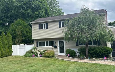 Photo of Aleta K.'s yard after getting lawn care in Brentwood, NY