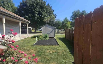 Photo of Gina S.'s yard after getting lawn care in Moline, IL