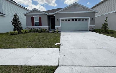 Photo of Barbara C.'s yard after getting lawn care in Palm Bay, FL