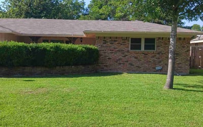 Photo of Addie G.'s yard after getting lawn care in Hurst, TX