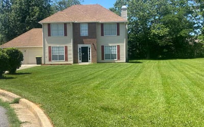 Photo of Alfre K.'s yard after getting lawn care in Jonesboro, AR