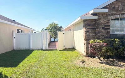 Photo of Caden M.'s yard after getting lawn care in Kissimmee, FL