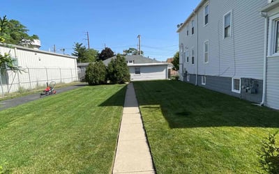 Photo of Anoh K.'s yard after getting lawn care in Bellwood, IL