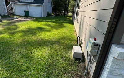 Photo of Rebecca M.'s yard after getting lawn care in Montgomery, TX