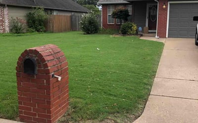 Photo of Bernadette B.'s yard after getting lawn care in Coweta, OK