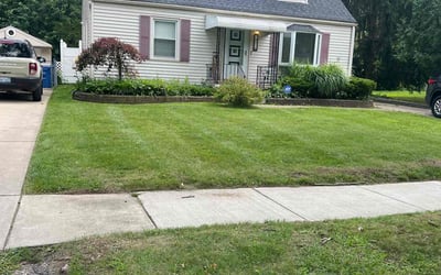 Photo of Rebecca G.'s yard after getting lawn care in Saint Clair, MI