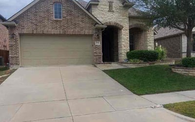 Photo of Charlotte D.'s yard after getting lawn care in Ennis, TX
