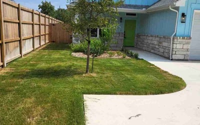 Photo of Adrienne G.'s yard after getting lawn care in New Braunfels, TX