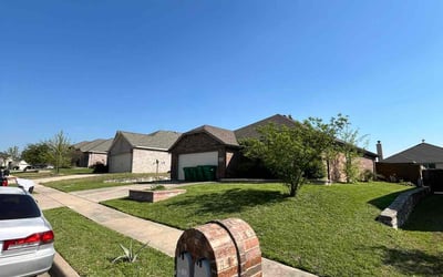 Photo of Nakita I.'s yard after getting lawn care in Quinlan, TX