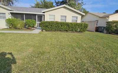 Photo of Loretta P.'s yard after getting lawn care in Boca Raton, FL