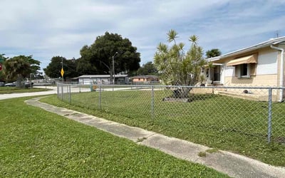 Photo of Amber F.'s yard after getting lawn care in Cocoa Beach, FL